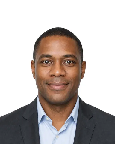 Example CV / LinkedIn photo (4:5): a man in a charcoal jacket and light blue shirt, white background (fictional AI-generated model)