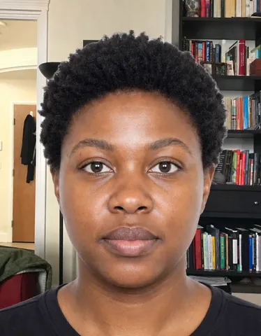Wrong France Passport Photo: a busy room is visible behind the person instead of a plain light blue background (fictional AI-generated model)