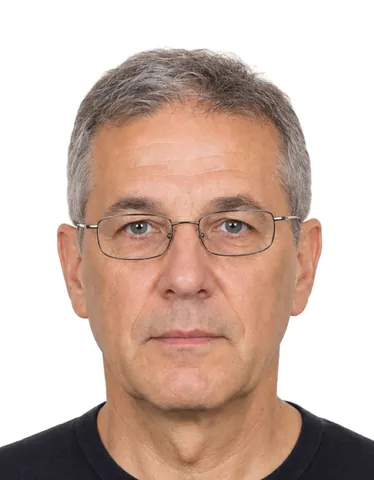 Example 35×45 mm photo: a man wearing glasses, white background (fictional AI-generated model)