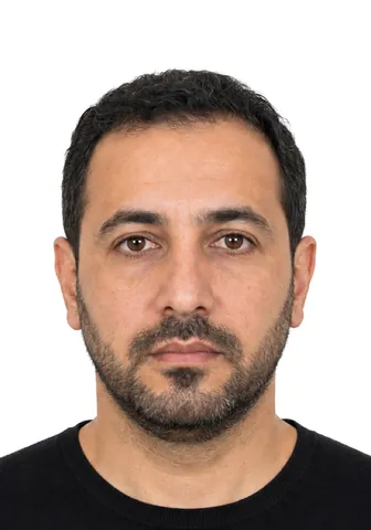 Example 35×50 mm photo: a man with a short beard, white background (fictional AI-generated model)