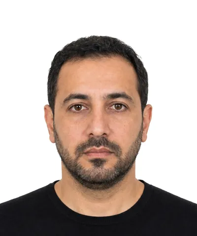 Example 50×60 mm photo: a man with a short beard, white background (fictional AI-generated model)